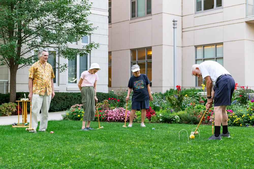residents at Admiral at the Lake playing croquet